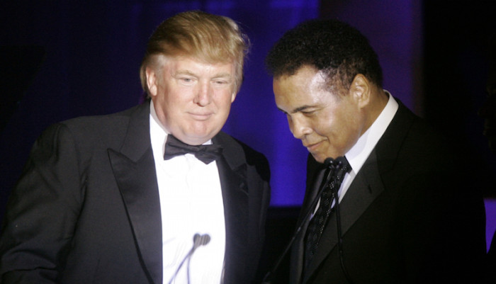 Donald Trump, left, accepts his Muhammad Ali award from Ali at Muhammad Ali's Celebrity Fight Night XIII in Phoenix, Ariz., Saturday, March 24, 2007. (AP Photo/Jeff Chiu)